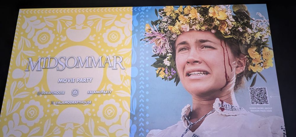 the Alamo Drafthouse midsommar movie party info card on the screen at the theater