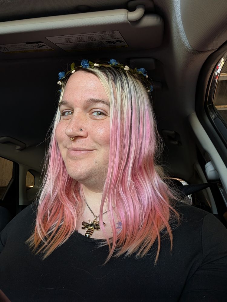 Mae smiling, wearing her flower crown