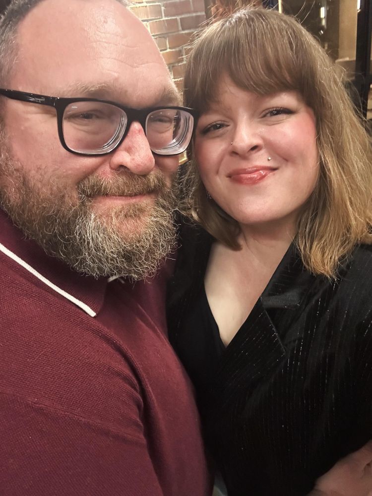 A stunning woman and a bearded man 