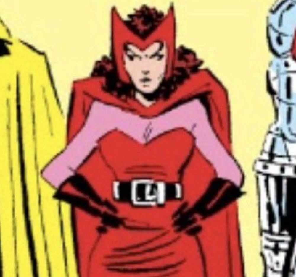 scarlet witch in an old comic, her hands are on her hips and she looks comically mad. Her eyes look like they’re going in different directions. 