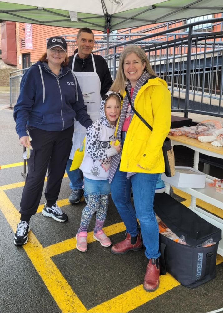 Atlantic Regional Director Bev Grasse with grillmaster Richard Grasse, and Premier Susan Holt and her daughter.