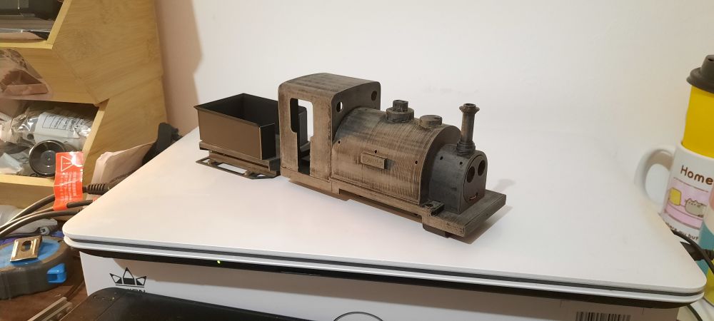 Image of a 3d printed bodyshell and tender of a thomas the tank engine train character named duke, he is sitting on a laptop