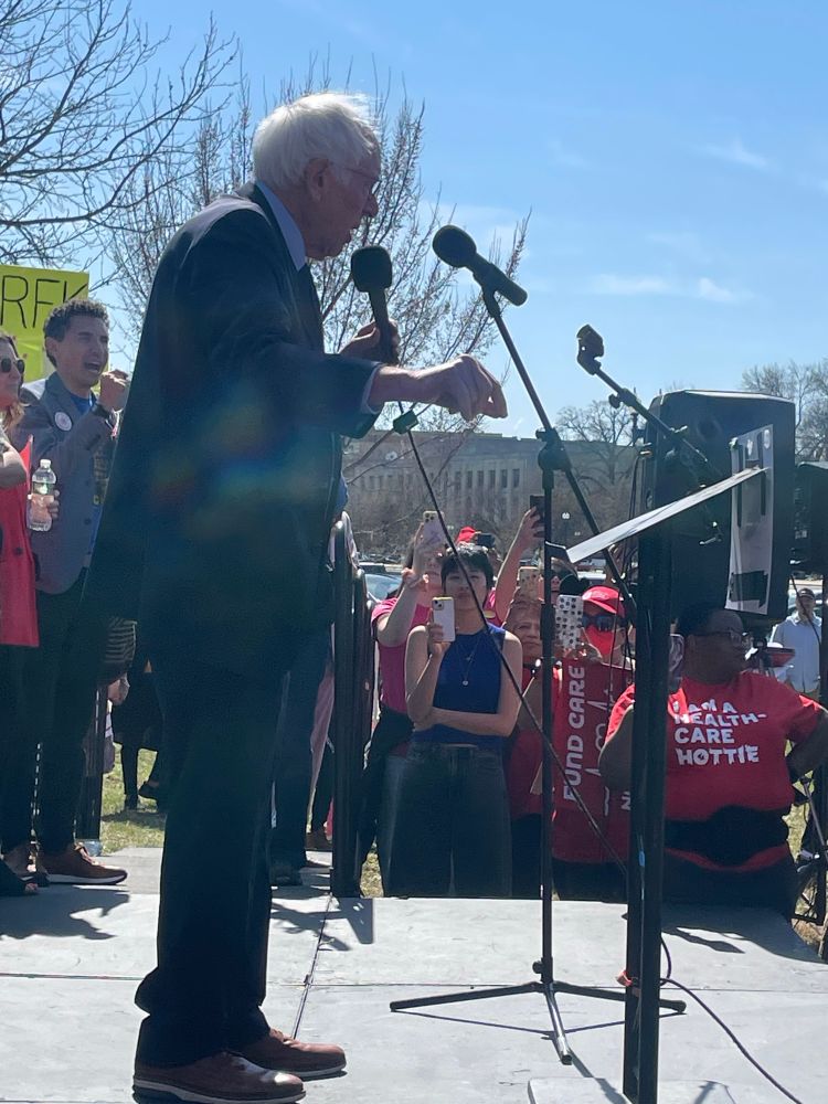 Bernie Sanders speaking to a crowd about Medicaid