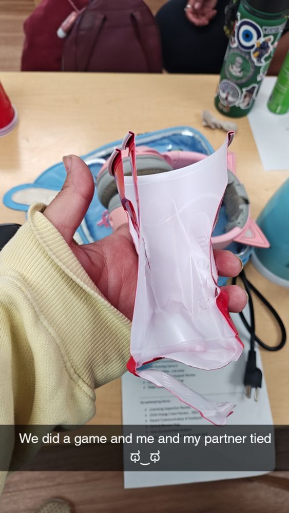 A solo cup torn in half