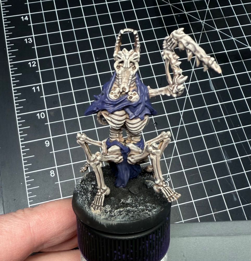 Monster composed of mismatched  bones. It has one large arm ending in a serrated skeletal blade. It stands on four legs attached to two pelvises, and appears to lumber in a crab-like fashion.