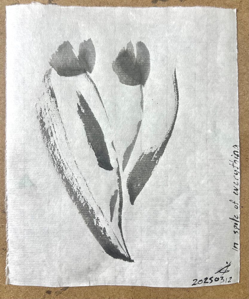 Two flowers framed by leaves. Sumi art in delicate greys. 250312 in the corner with initials. On the side it says ‘in spite of everything’. 