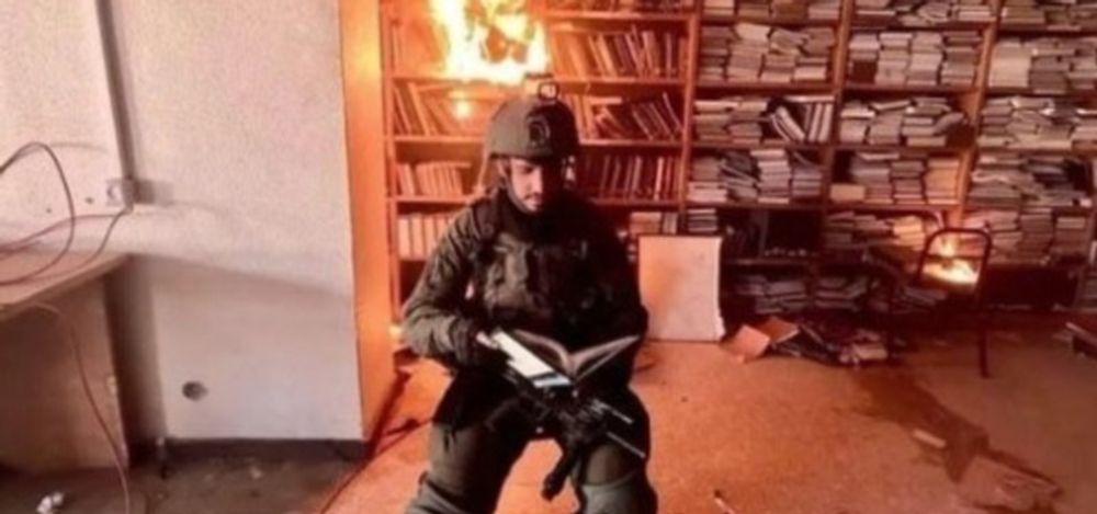 Israeli soldiers burn Al-Aqsa University library in Gaza Strip