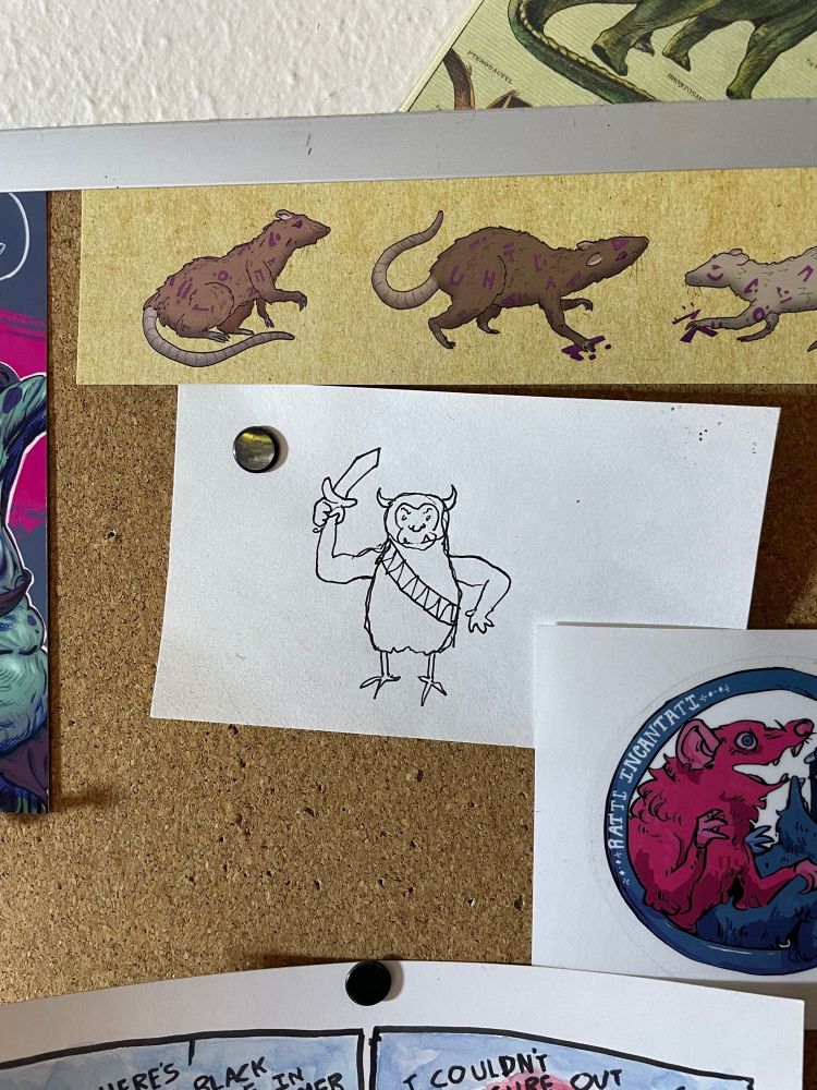 My drawing of what I remember the kobold miniature looking like. It has a furry body, chicken legs, human arms, an ape face, and cow horns. It’s carrying a short sword or dagger and wearing a sash. It’s drawn on an index card pinned to a cork board.