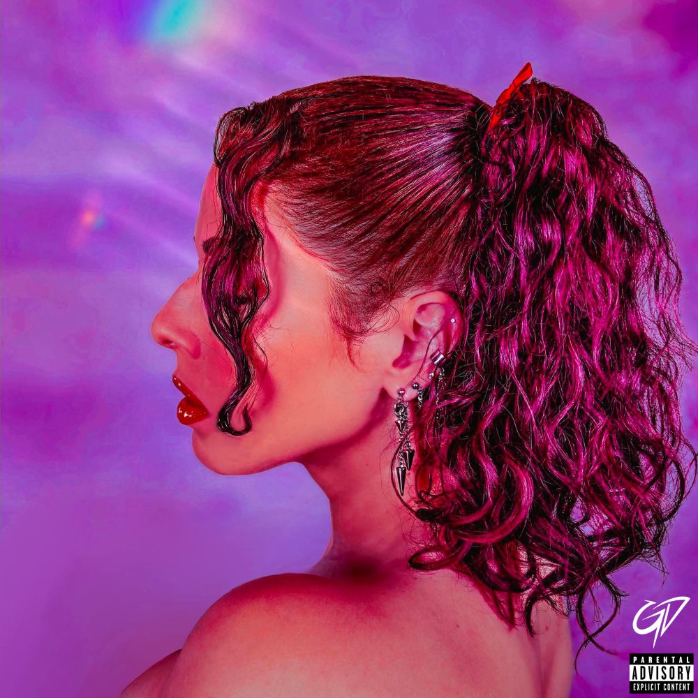 Cover art for Gabby Durden’s ‘TOO MUCH’ EP. Close-up profile view with hair pulled back in a high ponytail. Purple-toned background.