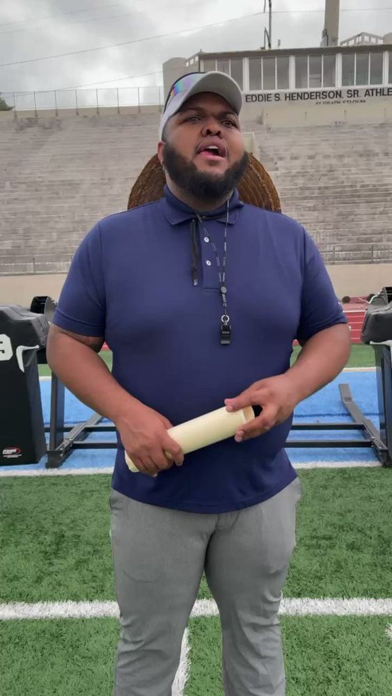 Druski dressed up like a football coach.