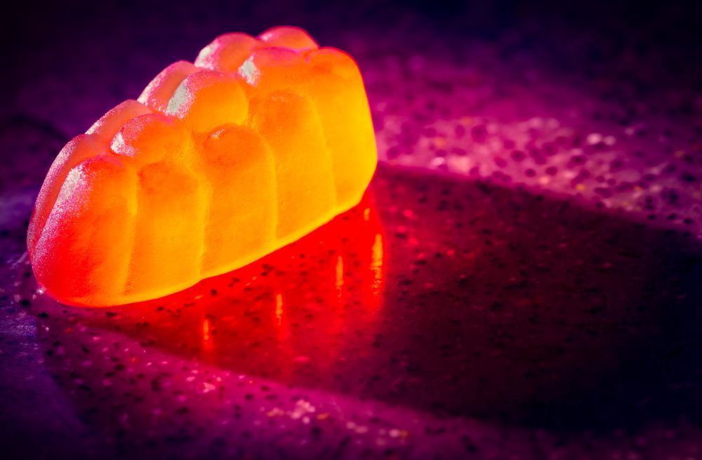 A macro photo of a strongly lit fruit snack candy. 