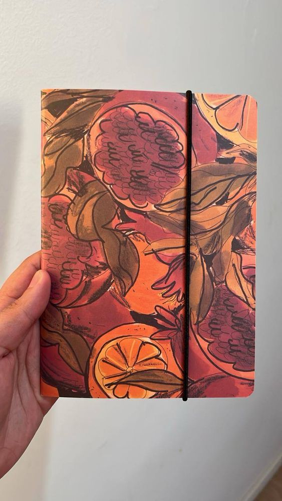 caderno romã e laranja