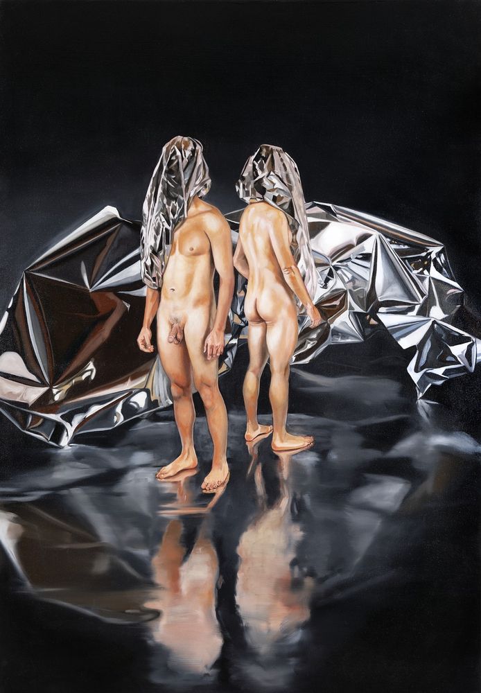 A realist oil painting of two nude male figures with their heads shrouded in metallic fabric standing in a reflective black space in front of a chrome boulder.