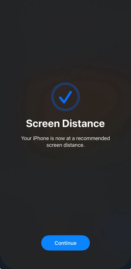 A screenshot of the Screen Distance feature on iOS. It puts up an overlay on the entire screen if you have your phone too close to your face