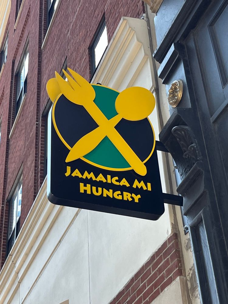 Jamaica Mi Hungry sign at their location on Devonshire Street.