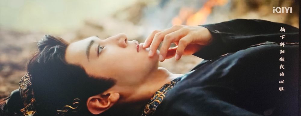 Feng Suige's eyes open after pretending to still be unconscious and he touches his lips in thinking she touched hers to his while performing cpr. This is from the cdrama Fated Hearts.