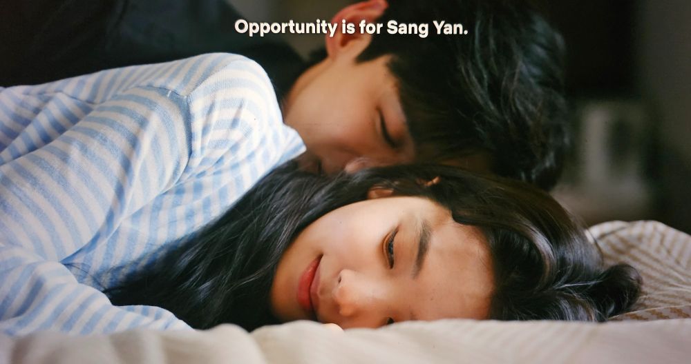 Sang Yan and Wen Yifan are lying side by side on a chase lounge. She smiles & says, "Opportunity is for Sang Yan." He wears a black dress shirt and she white and blue striped pjs. This is from the cdrama The First Frost.