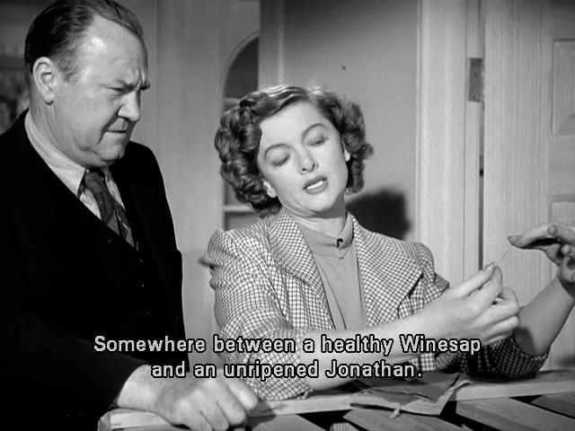 Myrna Loy holding a thread and saying to a house painter, 