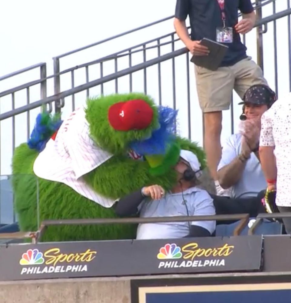 Phillie Phanatic kissing John Kruk on the mouth very romantically 