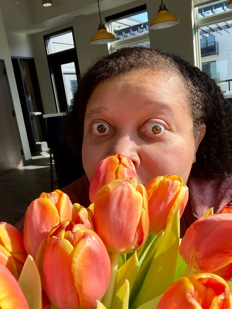 My face in the tulips 