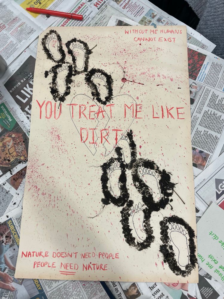 A group’s powerful protest piece, titled ‘You treat me like dirt’, with reference to soil. 