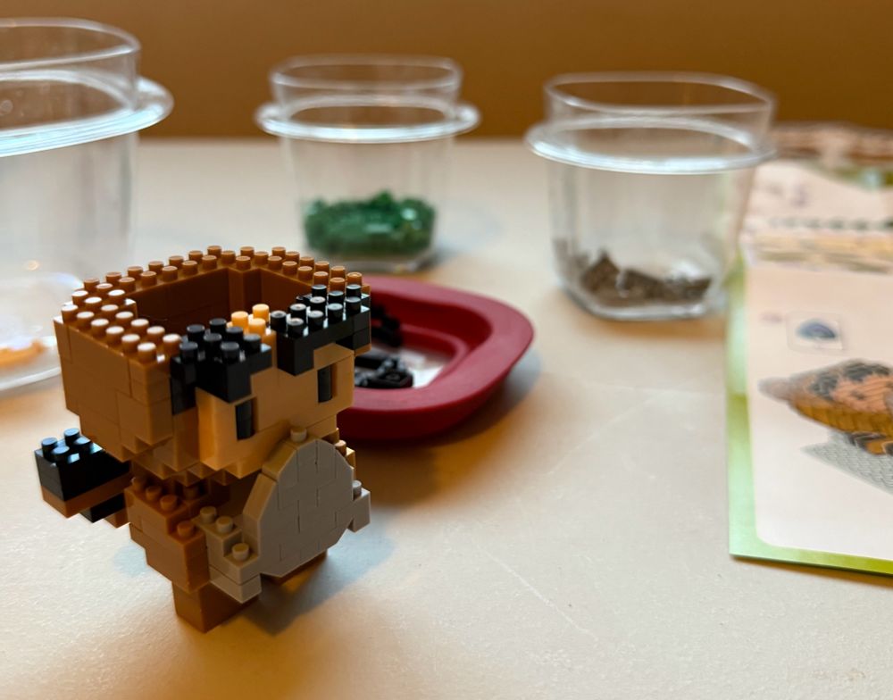 A small lego figurine of the salesforce mascot Astro is visible. The head hair and ears are all that’s left!