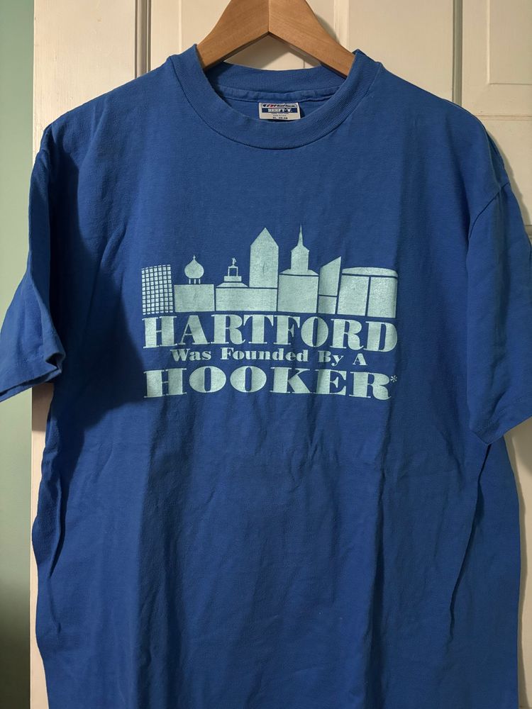 Icons of Hartford skyline with text, “Hartford was founded by a Hooker.”