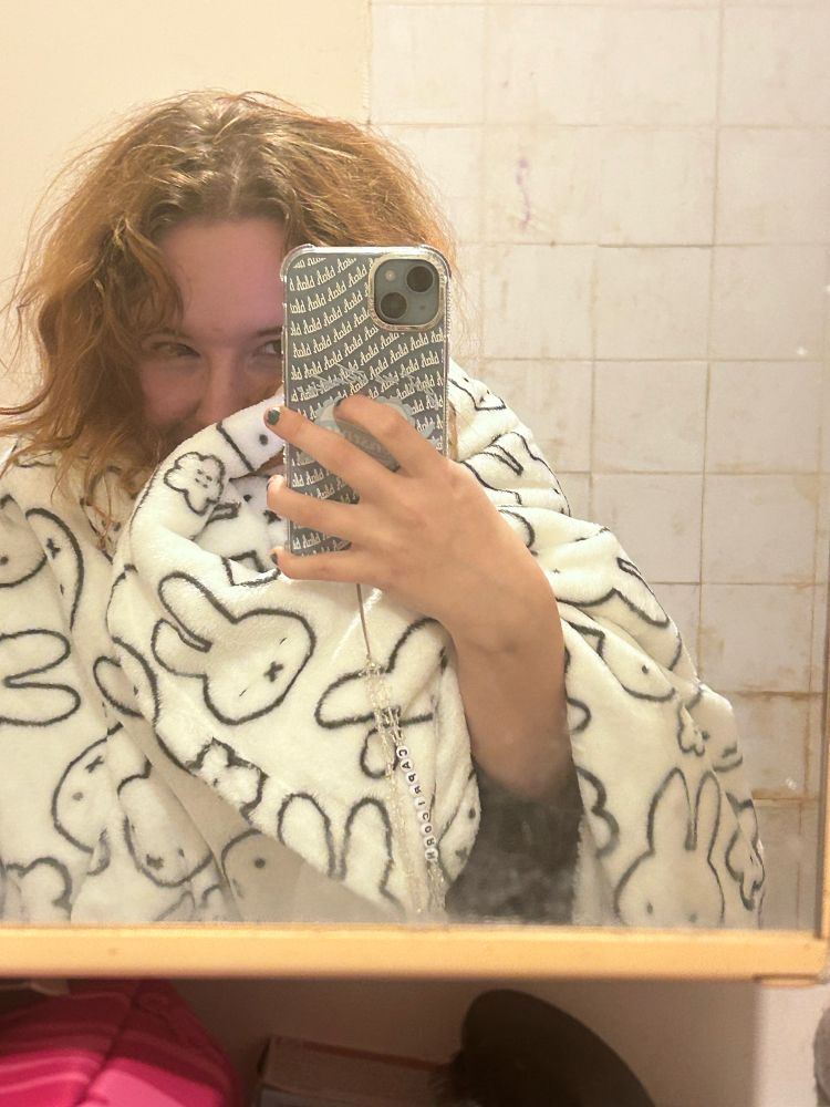 a selfie with my new phone with my face partially obscured by a miffy/nijntje fleece blanket (i am way too happy about this)