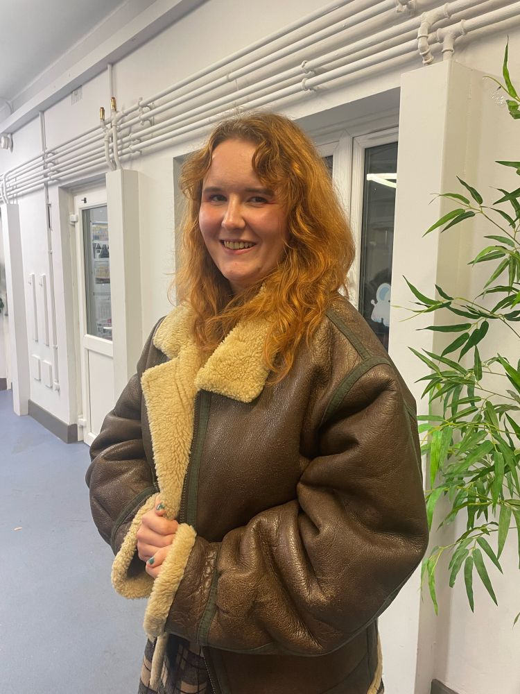 a photo of me wearing a genuine ww2 bomber pilot jacket (and looking far too happy about it)