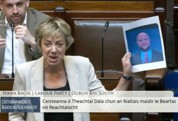 Member of parliament holding the bald Vance meme