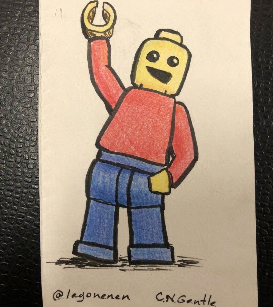 LEGO minifig waving hello, Yellow hands and head, with a lopsided smile; red shirt, and blue pants.