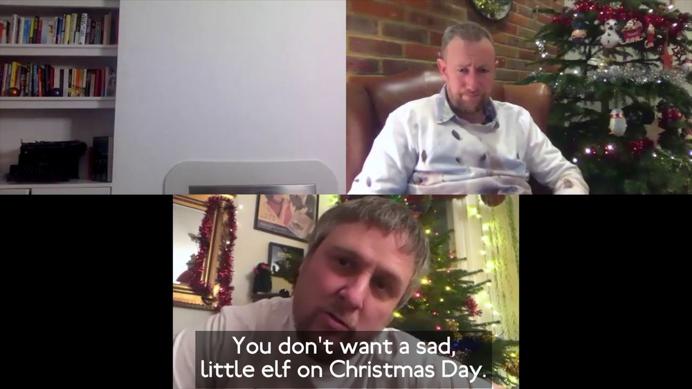 Screenshot of a Zoom call between three friends, playing a parlour game. Horne and Key both have Christmas trees behind them. Watson is not in his square. Horne says "You don't want a sad little elf on Christmas Day."