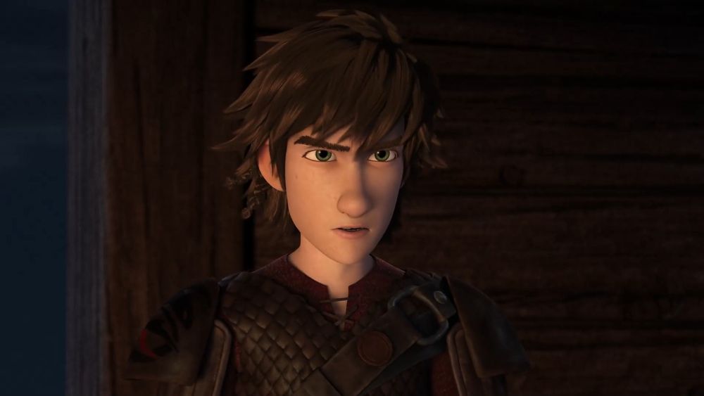medium close-up shot of rtte hiccup; eyebrows furrowed, eyes narrowed, mouth slightly open in the middle of saying something, appearing angey;
it's nighttime and only his face is illuminated by fireglow; background is a wooden wall with a small strip of the sky on the left