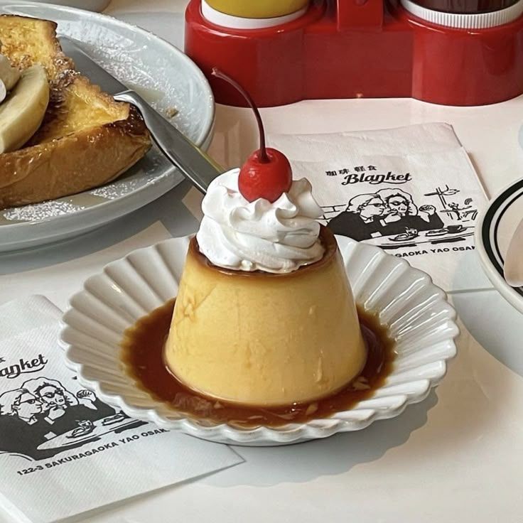 search: food
crème brulé with whipped cream and a cherry on top on a white plate