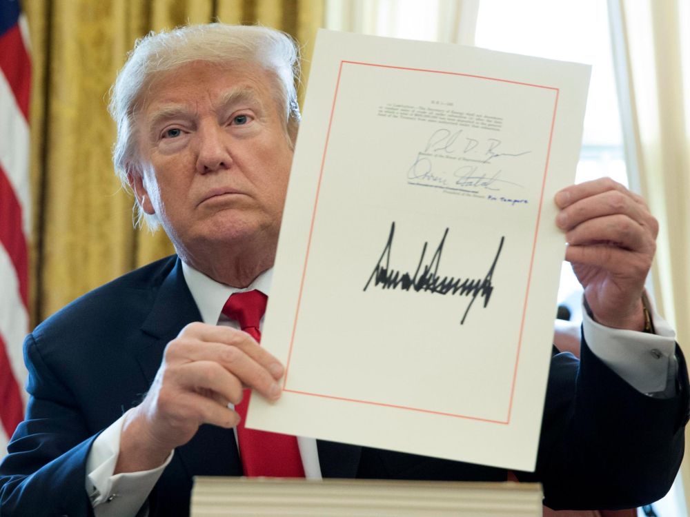 President Trump signs a bill absolving his office and law enforcement from having to make statements after mass shootings.