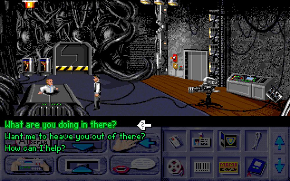 A scene from "Bi-Fi: Action in Hollywood". On a sci-fi set, the main character Lukas is talking to a man whose bottom half is trapped in a small hatch. There is a conversation menu with three options: "What are you doing in there?" "Want me to heave you out of there?" "How can I help?"
