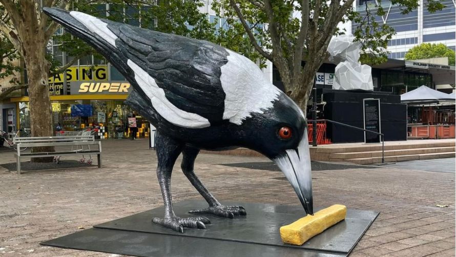 Sculpture of Australian magpie with a hot chip