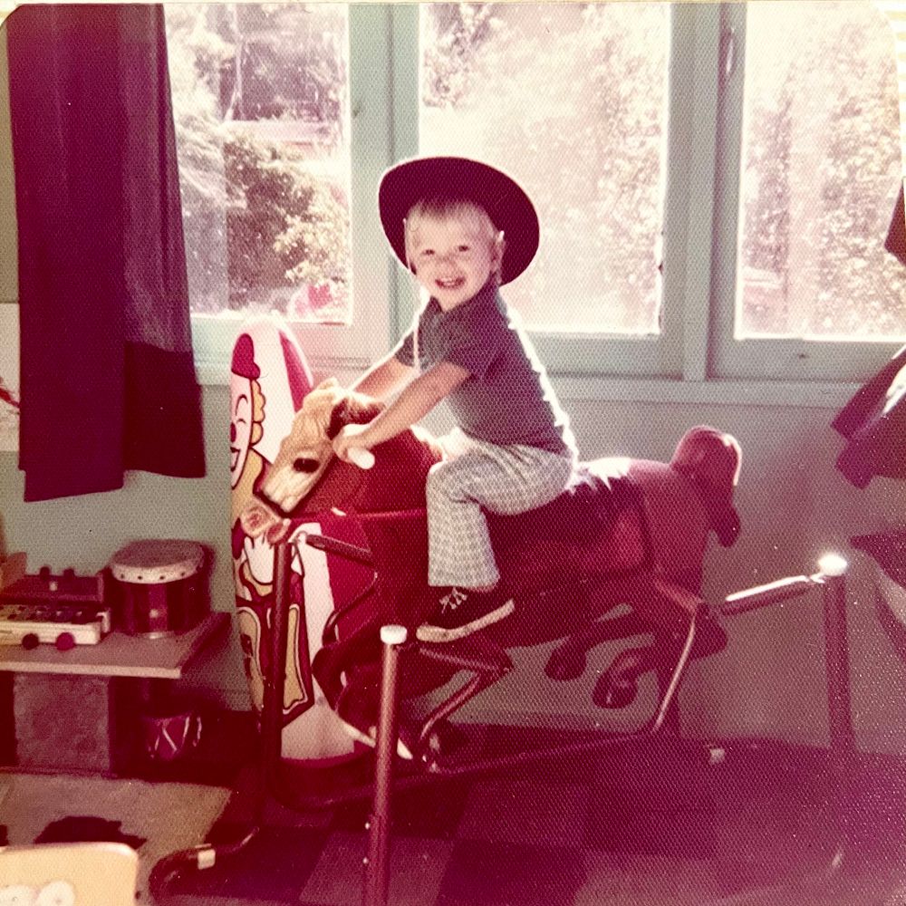 Little Joby on my mighty steed with an inflatable clown punching bag behind.
