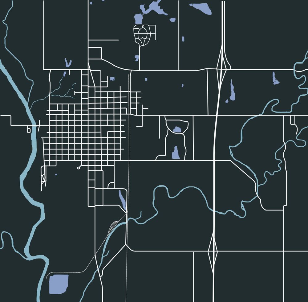 A map of Humboldt, Kansas roads rails, and rivers and creeks and ponds, a dark green background accentuating the rivers and creeks as well as the roads
