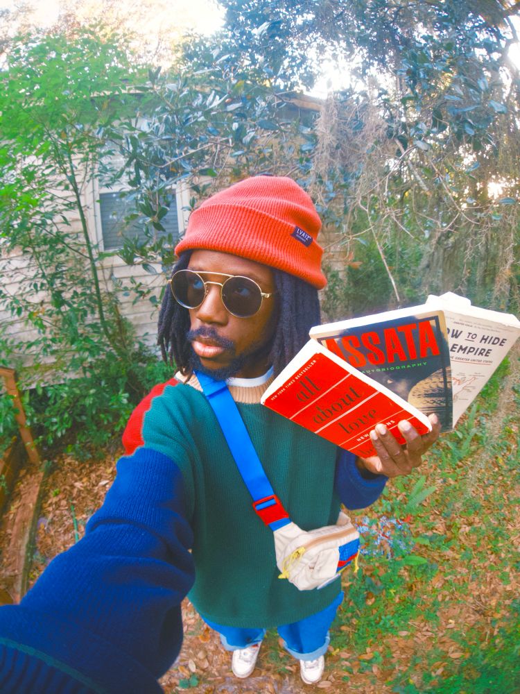 Selfie of JER holding 3 books 