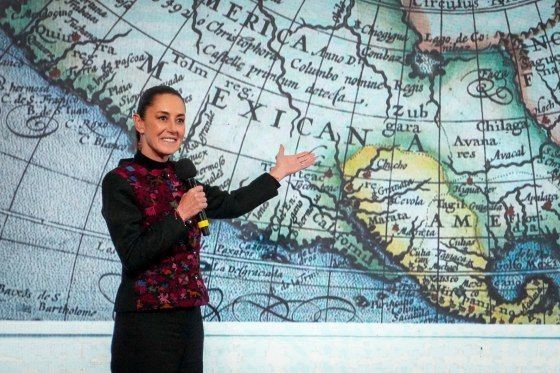 A photo of Mexico's president pointing to a map of Mexican America, as a response to Donald J. Trump's push to try to change the Golf of Mexico to the Golf of America.