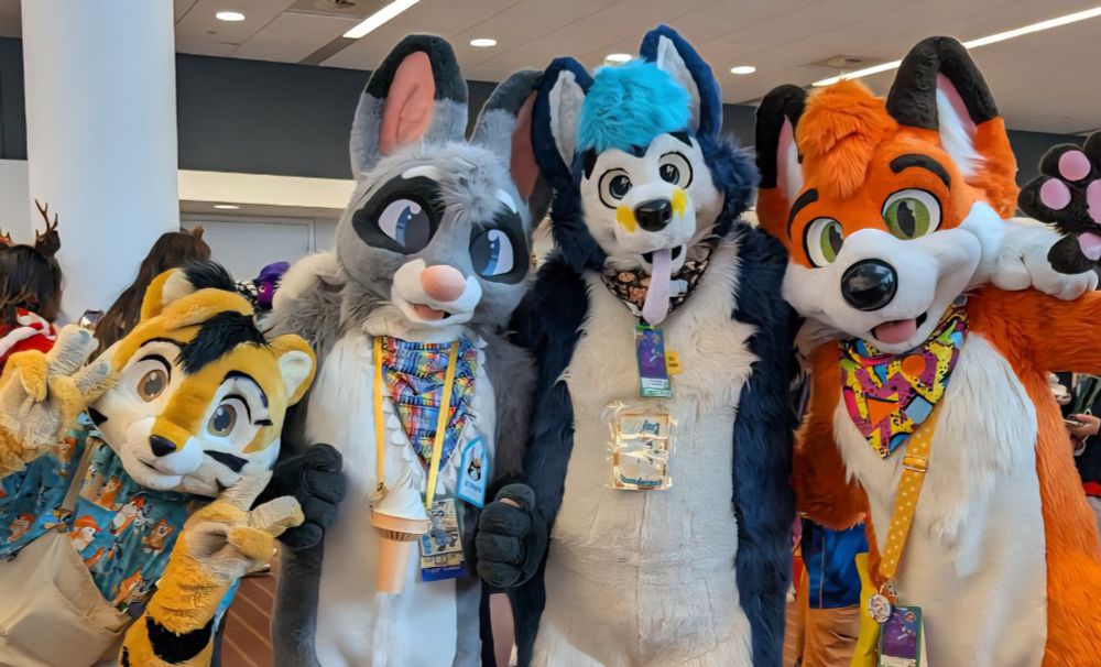 PyroTheFox, Scribbles, Thunderpup, and TaviMunk in fursuit at Anthrocon