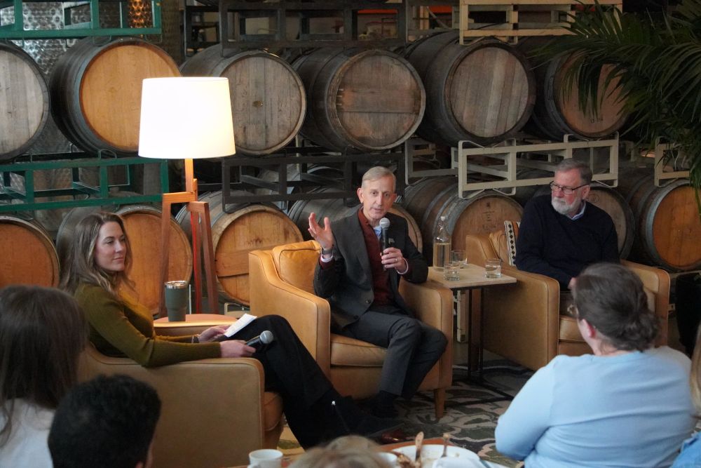 Mayor Keith Wilson and City Administrator Michael Jordan seated in front of an audience for a discussion.