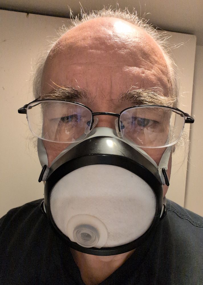 Selfie of me, with my glasses fitting into the divots on my flomask.