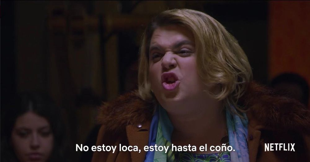 Paquita Salas, with short blond hair wearing a brown jacket yells "no estoy loca, estoy hasta el coño" (translation: I'm not crazy, I'm fed up)