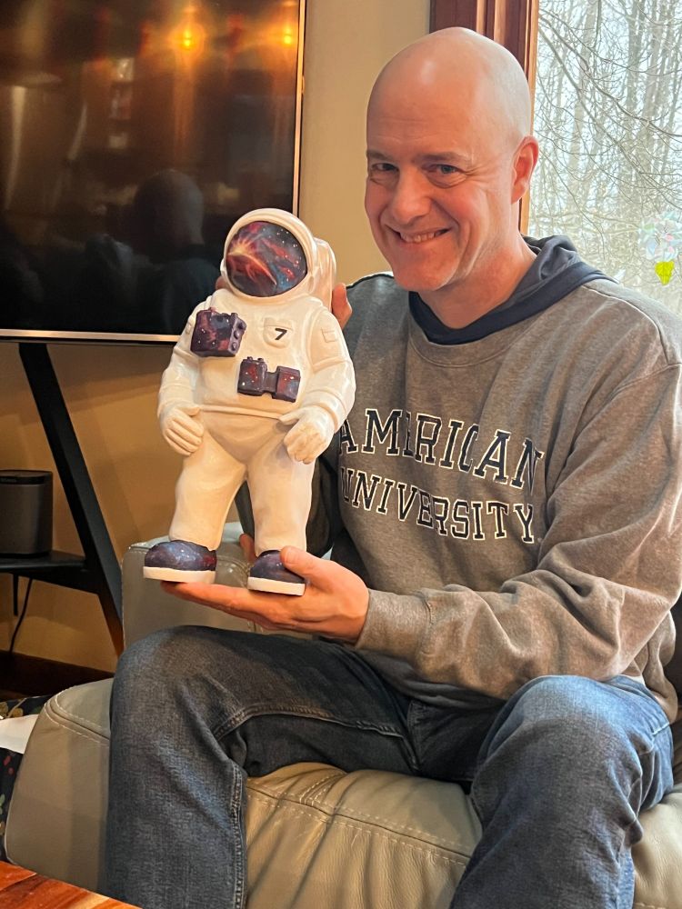 Photo of the author holding a gnome-sized Mickey7
