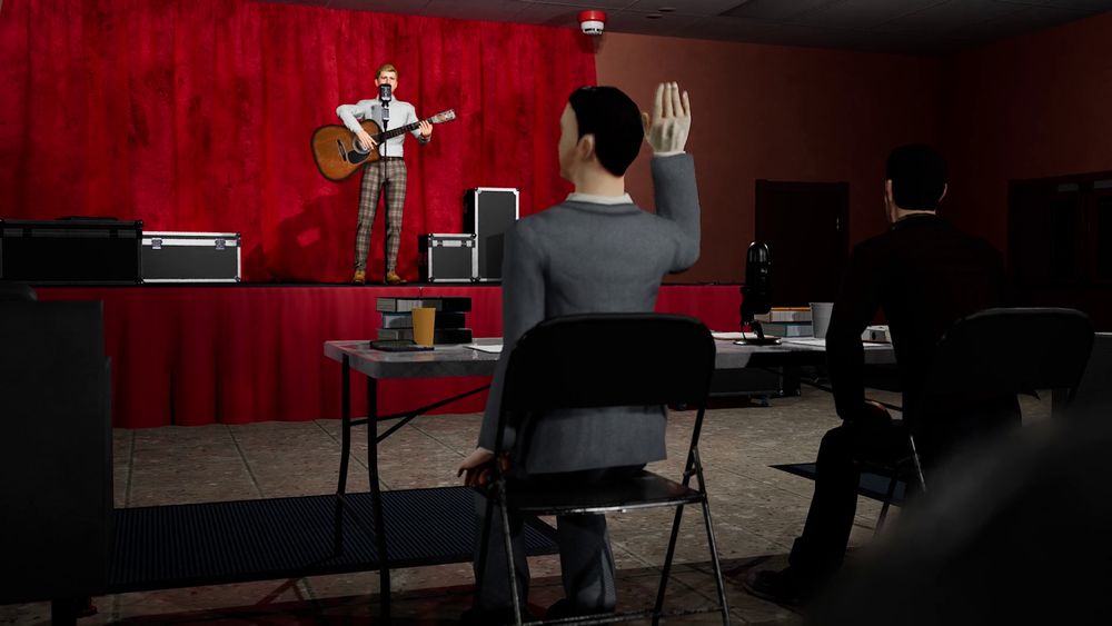 A man on stage of a talent show as the two judges stop him mid performance.
