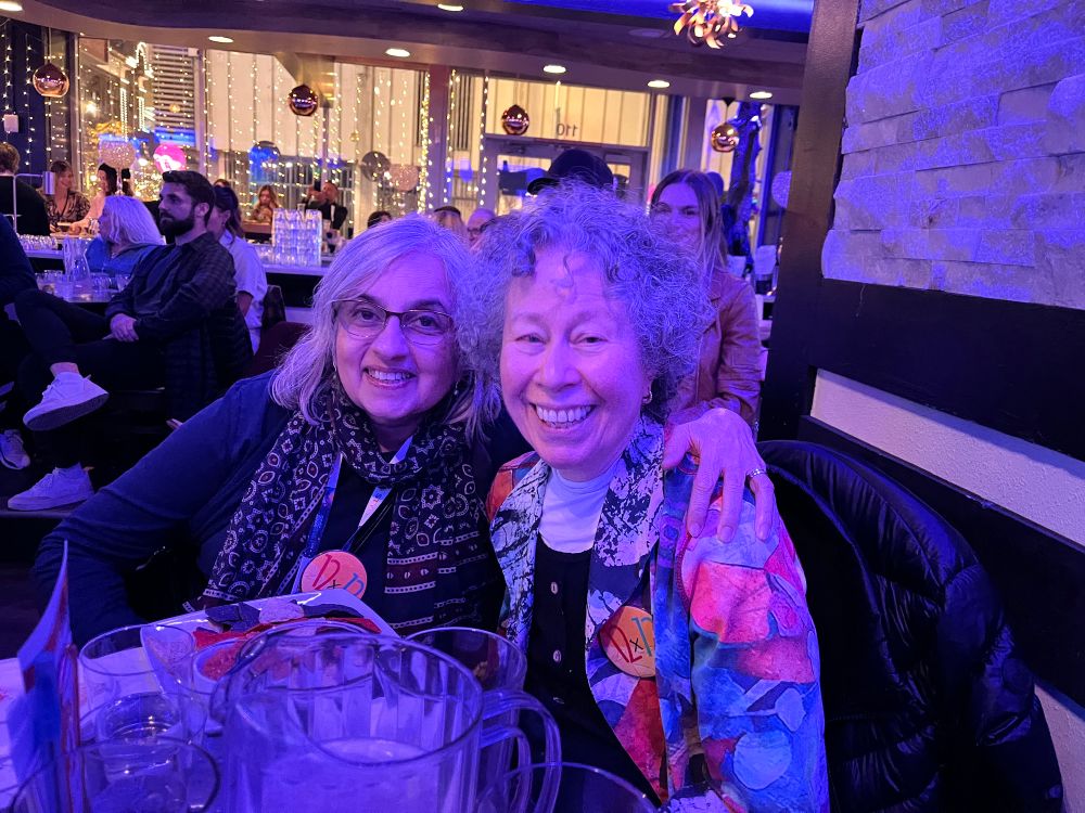 Vivian Kirkfield and Shirin Shamsi with purple neon light.