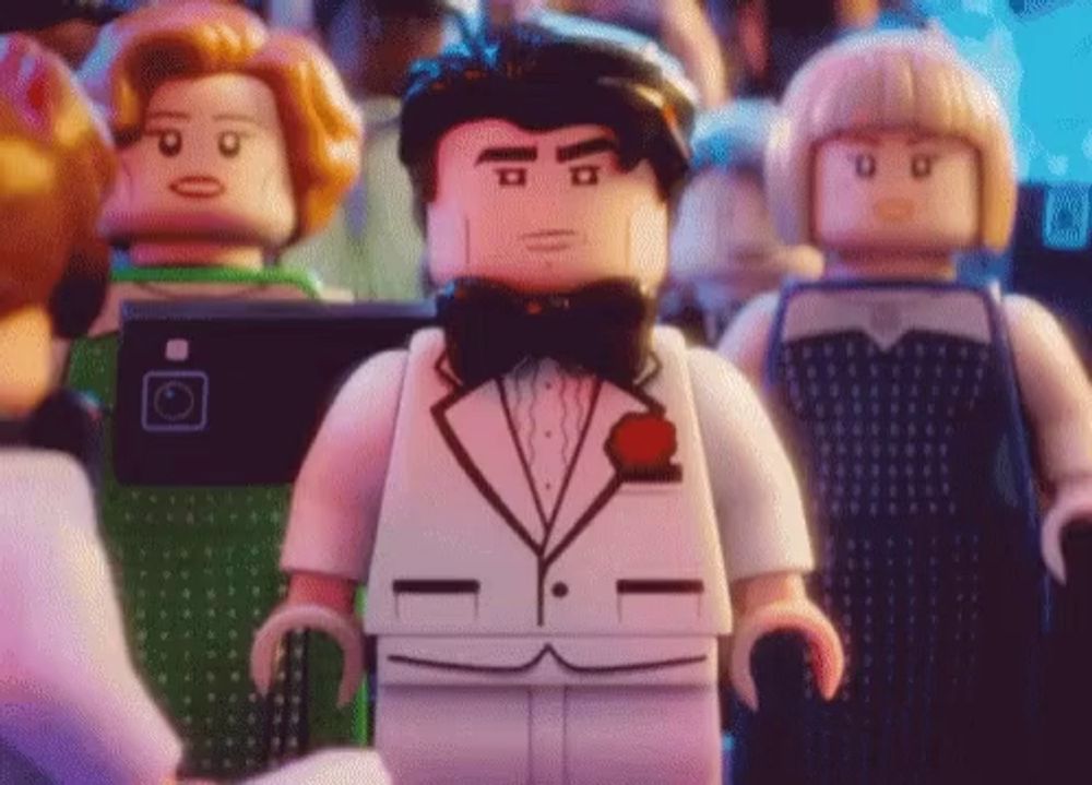 a lego man in a tuxedo and bow tie