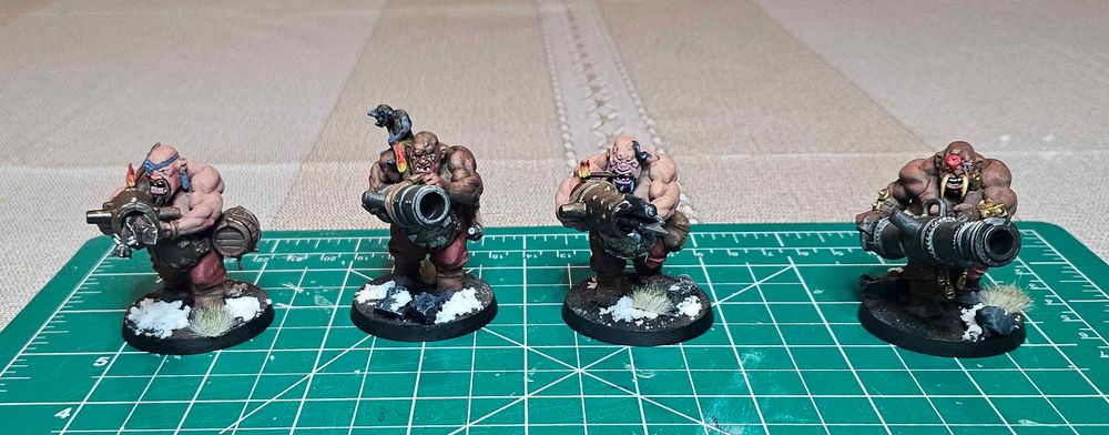 A unit of 4 Ogor Lead Belchers, from the Age of Sigmar Spearhead box. They are painted with red pants and varying skin tones.